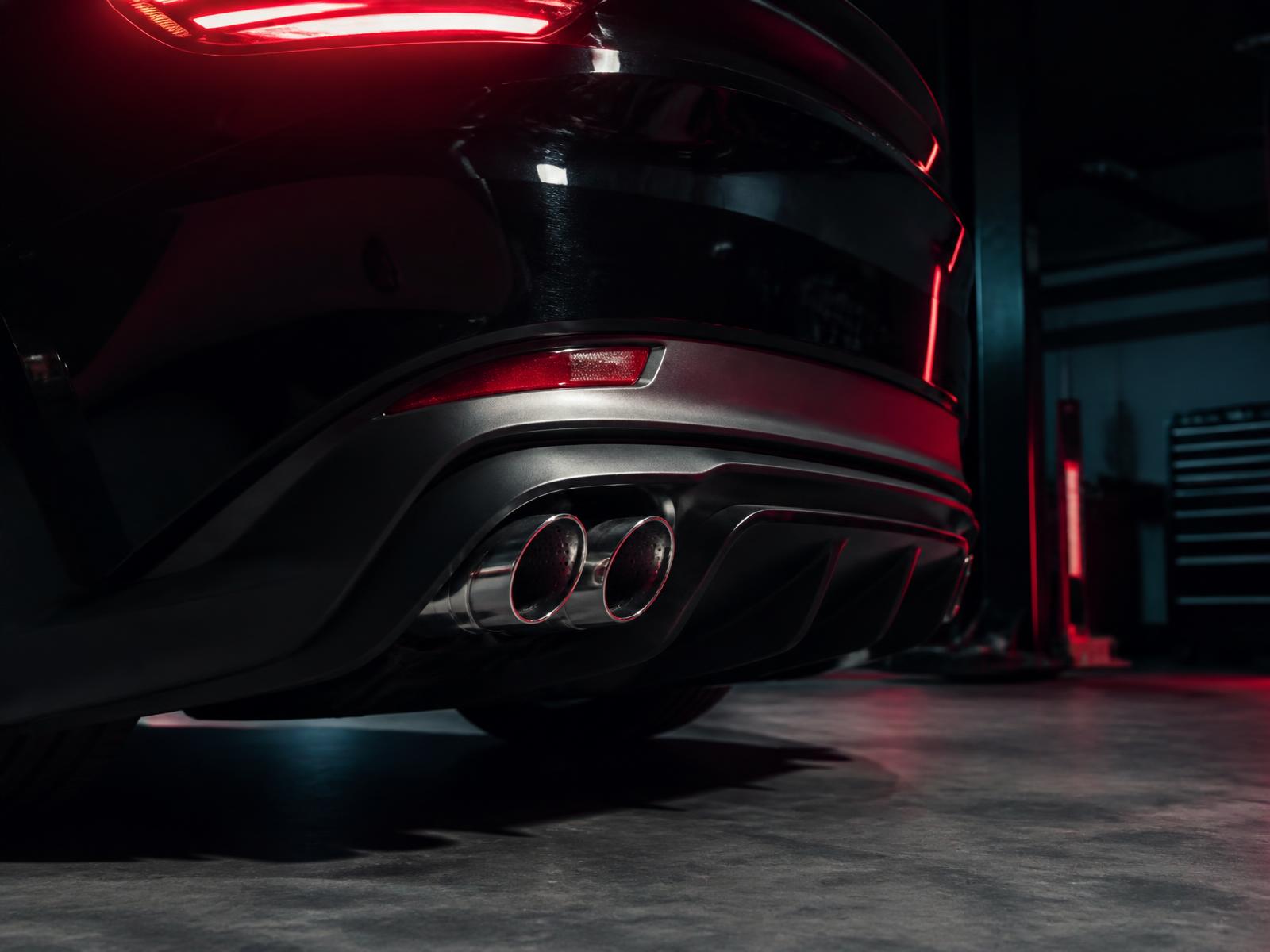 Close-up performance exhaust tips on a European car